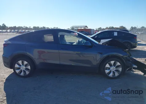 2023 Tesla Model Y Awd/Long Range Dual Motor All-Wheel Drive z USA, uszkodzony, nr VIN 7SAYGDEE4PA161053